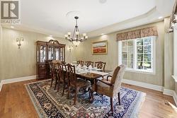 Formal Dining Room Features a Coffered Ceiling - 