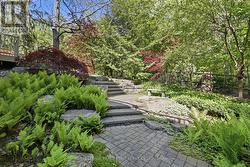 The Backyard Oasis Features Extensive River Rock - 