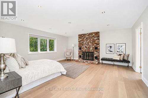 12 Bunting Court, Ajax, ON - Indoor Photo Showing Bedroom With Fireplace