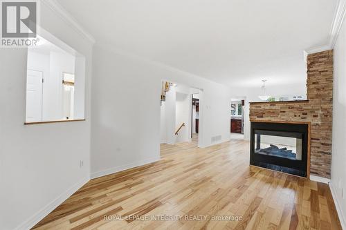 76 Hunterswood Crescent, Ottawa, ON - Indoor Photo Showing Living Room With Fireplace
