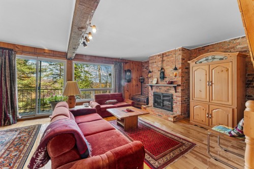 Salle familiale - 1697 Ch. Du Mont-Gabriel, Sainte-Adèle, QC - Indoor Photo Showing Living Room With Fireplace