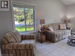 Double-paned window with grid inserts and white trim - 