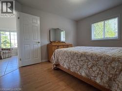 2nd Bedroom, a white-framed window with horizontal blinds, and neutral wall paint - 