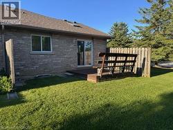 Expansive green lawn with a private wooden fence - 