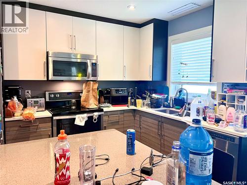 110 Childers Crescent, Saskatoon, SK - Indoor Photo Showing Kitchen With Double Sink
