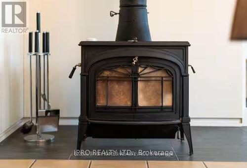 39 Long Point Road, Tay, ON - Indoor Photo Showing Other Room With Fireplace