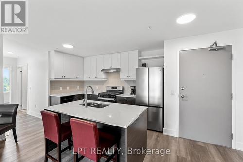 402 - 19B West Street N, Kawartha Lakes, ON - Indoor Photo Showing Kitchen With Double Sink