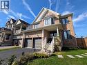 Brick exterior with a covered front porch featuring white columns and railings - 37 Mull Avenue, Caledonia, ON  - Outdoor With Facade 