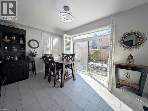 Sliding glass doors provide access to the exterior space - 37 Mull Avenue, Caledonia, ON - Indoor Photo Showing Dining Room