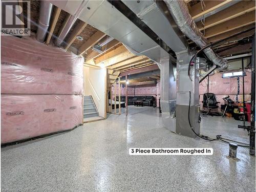 Spacious unfinished basement offering a rough-in for a 3-piece bathroom, exposed ceiling joists, insulated perimeter walls, and a staircase - 37 Mull Avenue, Caledonia, ON - Indoor Photo Showing Basement