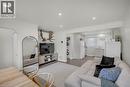 Bright living area featuring wood-finish flooring and recessed lighting - 450 Highland Road E, Kitchener, ON 