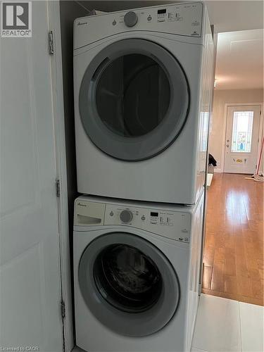 Stackable washer and dryer unit, featuring front-loading doors and integrated control panels - 179 S Vine Street S, St. Catharines, ON 