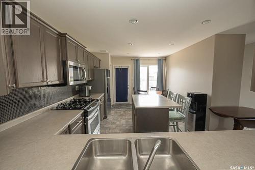 363 Levalley Cove, Saskatoon, SK - Indoor Photo Showing Kitchen With Stainless Steel Kitchen With Double Sink