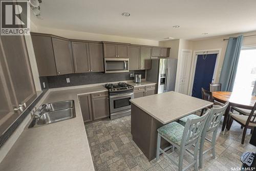 363 Levalley Cove, Saskatoon, SK - Indoor Photo Showing Kitchen With Stainless Steel Kitchen With Double Sink