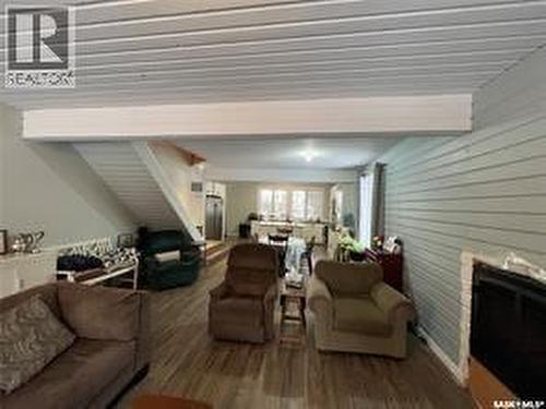 20 Nipew Place, Candle Lake, SK - Indoor Photo Showing Living Room With Fireplace