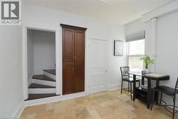 Light-toned tile flooring throughout - 