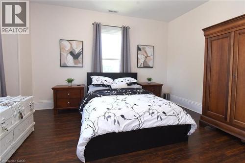 Bedroom featuring rich wood-finish flooring and neutral wall tones - 89 Lynden Road, Lynden, ON 