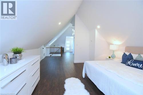 Spacious room featuring sloped ceilings, recessed lighting, dark wood-finish flooring - 89 Lynden Road, Lynden, ON 
