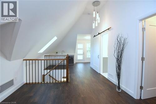 Primary bedroom with wet bar, walk out to private back yard facing balcony, walk in closet, 7 piece bathroom - 89 Lynden Road, Lynden, ON 