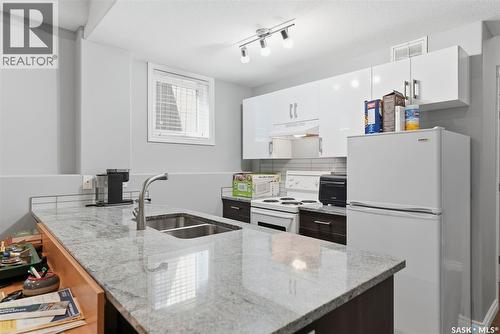 711 Sutter Crescent, Saskatoon, SK - Indoor Photo Showing Kitchen With Double Sink