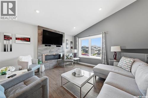 711 Sutter Crescent, Saskatoon, SK - Indoor Photo Showing Living Room With Fireplace