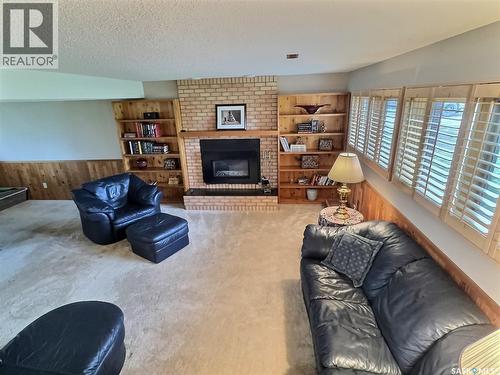 322 Spruce Drive, Estevan, SK - Indoor Photo Showing Living Room With Fireplace