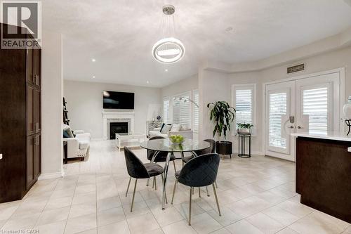 85 Showcase Drive, Hamilton, ON - Indoor Photo Showing Dining Room With Fireplace