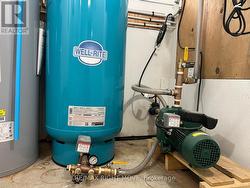 Newer water source pump and pressure tank. - 