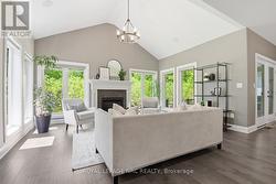 The extra sunroom space with 6 windows! - 