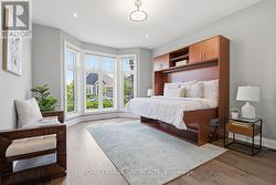 Front bedroom features bay window & wood floors - 