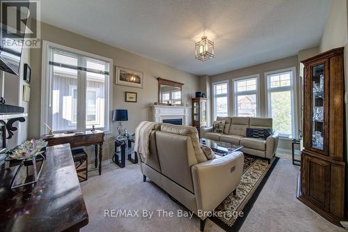 100 Allegra Drive, Wasaga Beach, ON - Indoor Photo Showing Living Room With Fireplace
