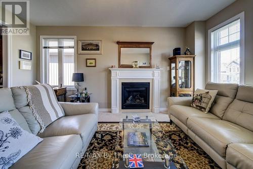 100 Allegra Drive, Wasaga Beach, ON - Indoor Photo Showing Living Room With Fireplace