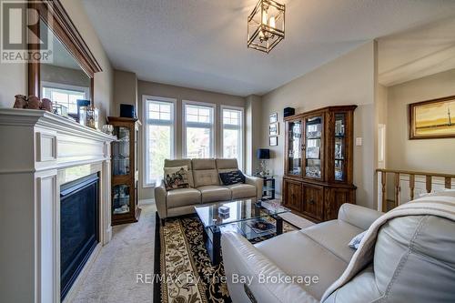 100 Allegra Drive, Wasaga Beach, ON - Indoor Photo Showing Living Room With Fireplace