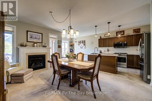 100 Allegra Drive, Wasaga Beach, ON - Indoor Photo Showing Dining Room With Fireplace