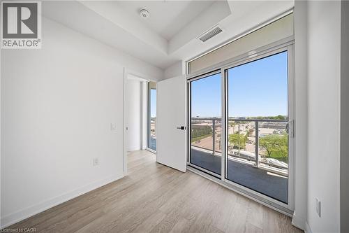 Room featuring light wood-finish flooring, white painted walls, and a recessed ceiling - 2782 Barton Street E Unit# 516, Hamilton, ON - Indoor Photo Showing Other Room