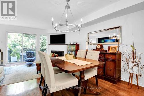 7 Academy Private, Ottawa, ON - Indoor Photo Showing Dining Room With Fireplace