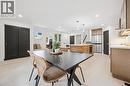 Dining space featuring recessed lighting, arched walkways, and light wood finished floors - 459 Drummerhill Crescent, Waterloo, ON  - Indoor Photo Showing Other Room 