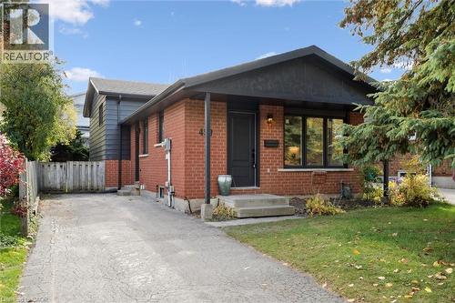 Bungalow with brick siding and asphalt driveway - 459 Drummerhill Crescent, Waterloo, ON - Outdoor