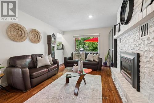 109 Ashberry Place, Waterloo, ON - Indoor Photo Showing Living Room With Fireplace