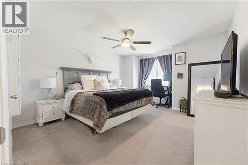 Spacious bedroom featuring light neutral wall paint and plush carpet flooring - 100 Chester Drive Unit# 16, Cambridge, ON - Indoor Photo Showing Bedroom