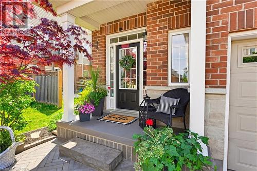 Brick and stone facade featuring a portico entry with white columns - 100 Chester Drive Unit# 16, Cambridge, ON - Outdoor With Exterior