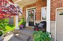 Brick and stone facade featuring a portico entry with white columns - 100 Chester Drive Unit# 16, Cambridge, ON  - Outdoor With Exterior 