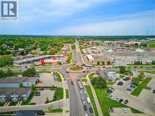 Aerial perspective showcasing a multi-lane road network with a central roundabout - 100 Chester Drive Unit# 16, Cambridge, ON - Outdoor With View