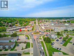 Aerial perspective showcasing a multi-lane road network with a central roundabout - 