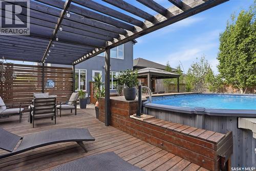 707 Sauer Crescent, Saskatoon, SK - Outdoor With Above Ground Pool With Deck Patio Veranda With Exterior