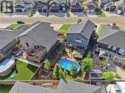 707 Sauer Crescent, Saskatoon, SK - Outdoor With Above Ground Pool With Deck Patio Veranda