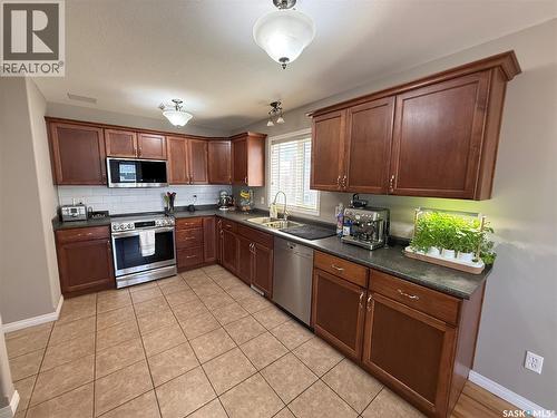 3102 37Th Street W, Saskatoon, SK - Indoor Photo Showing Kitchen With Double Sink