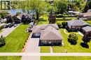 Single-story residence featuring a front lawn and paved driveway - 100 Mechanic Street W, Waterford, ON  - Outdoor 