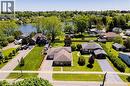 Lakeside property featuring a spacious lot with mature trees, expansive green lawn, and proximity to water - 100 Mechanic Street W, Waterford, ON  - Outdoor With Body Of Water With View 