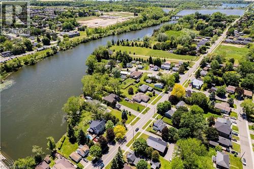 Waterfront properties along a winding river, bordered by established residential areas and abundant green spaces - 100 Mechanic Street W, Waterford, ON - Outdoor With Body Of Water With View